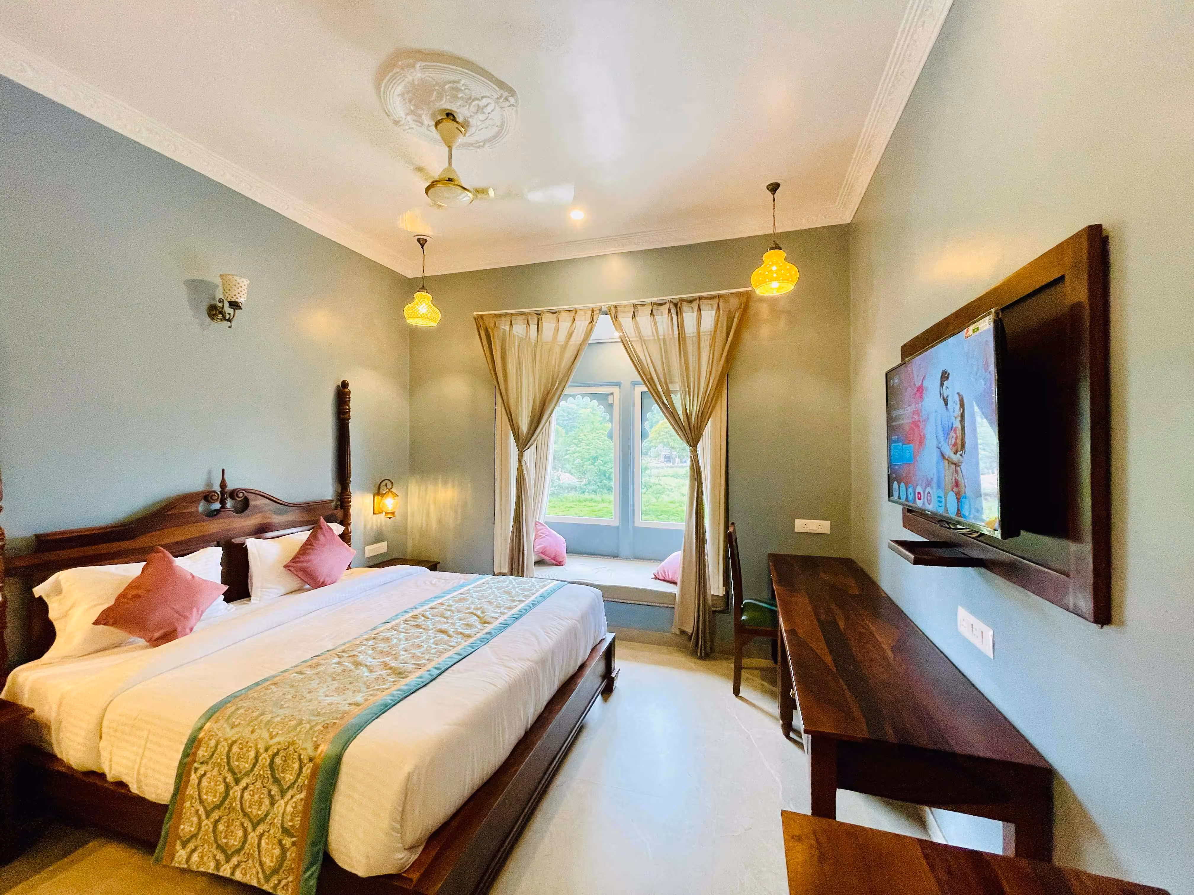 Lounge chairs next to an infinity pool overlooking the ocean.